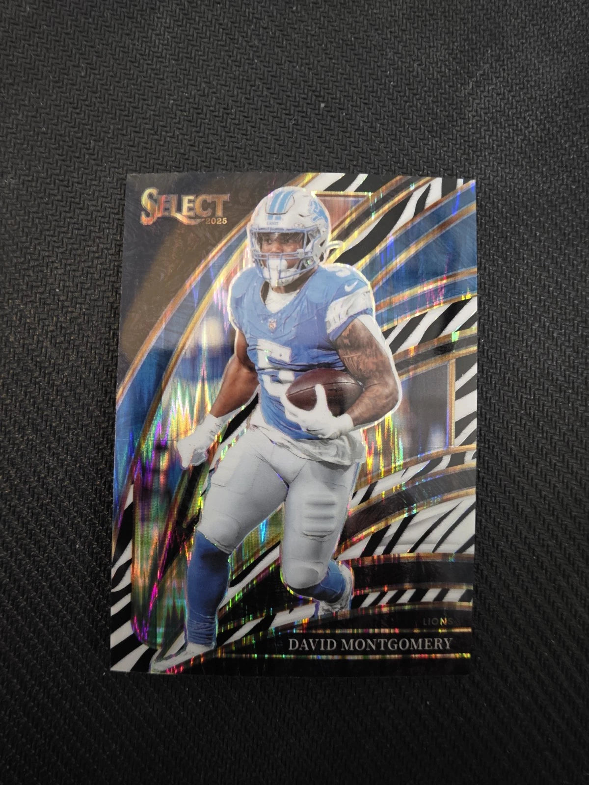 2025 Panini Select - David Montgomery - Zebra Club Level Prizm - VGMX